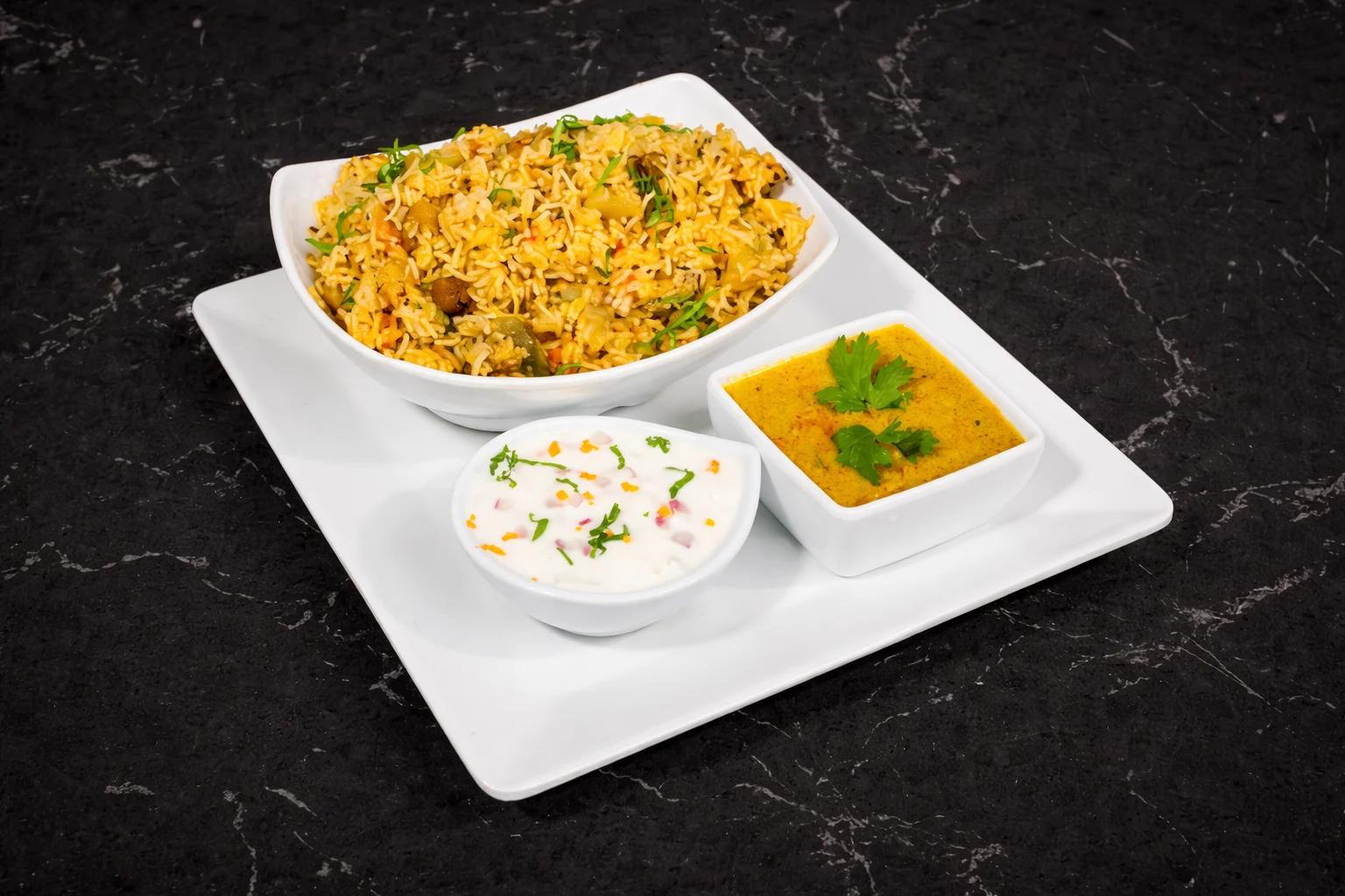Vegetarian South Indian dishes for first-time visitors including Masala Dosa, Idli Sambar, Uttapam, and Medu Vada served at A2B NC North Carolina