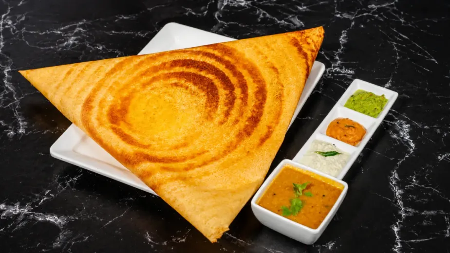 South Indian family dinner featuring Masala Dosa, Vegetable Biryani, Paneer Butter Masala, and Idli Sambar at A2B NC North Carolina